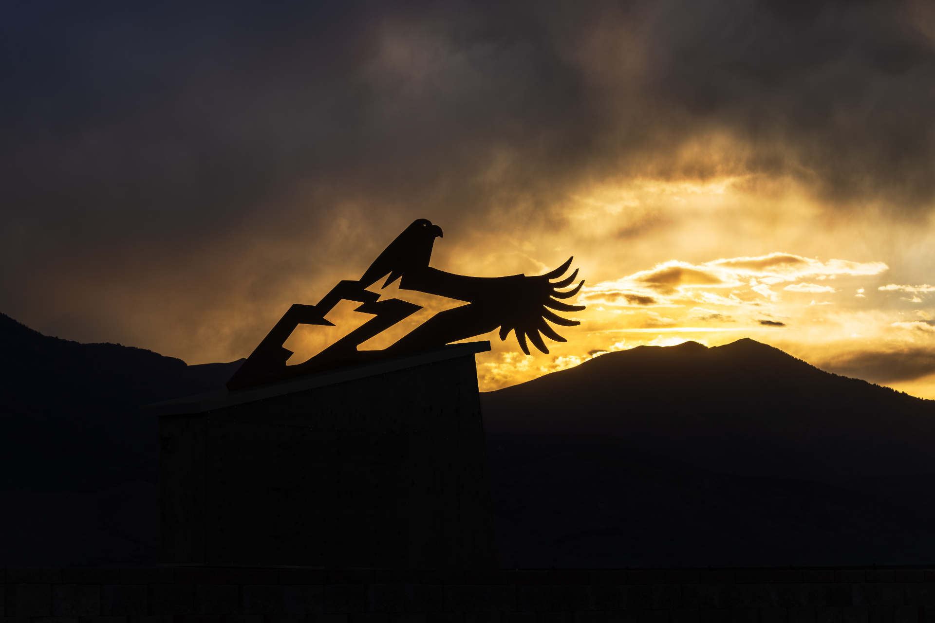 Iron eagle sculpture silhouetted at sunset in Eagle Mountain